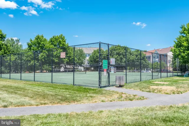 a view of a backyard with a trampoline