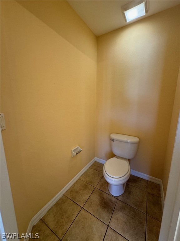 1841 Landale Loop Lehigh Acres, FL 33972 - Photo 11 of 21 a white toilet sitting next to a white wall
