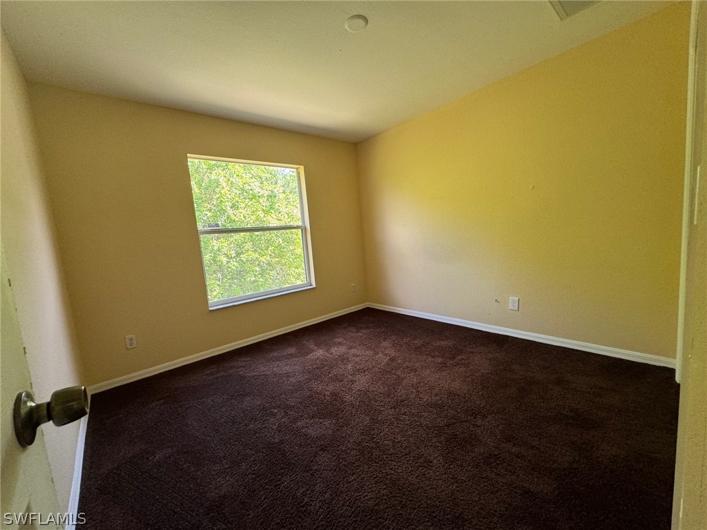 1841 Landale Loop Lehigh Acres, FL 33972 - Photo 15 of 21 an empty room with a empty space and a window
