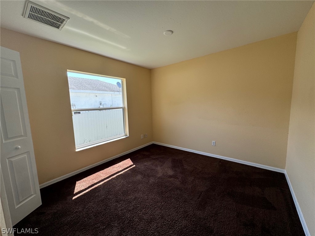 1841 Landale Loop Lehigh Acres, FL 33972 - Photo 17 of 21 an empty room with a window
