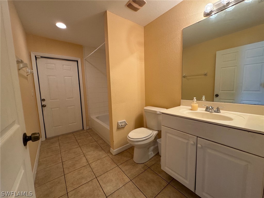 1841 Landale Loop Lehigh Acres, FL 33972 - Photo 18 of 21 a bathroom with a sink toilet and shower