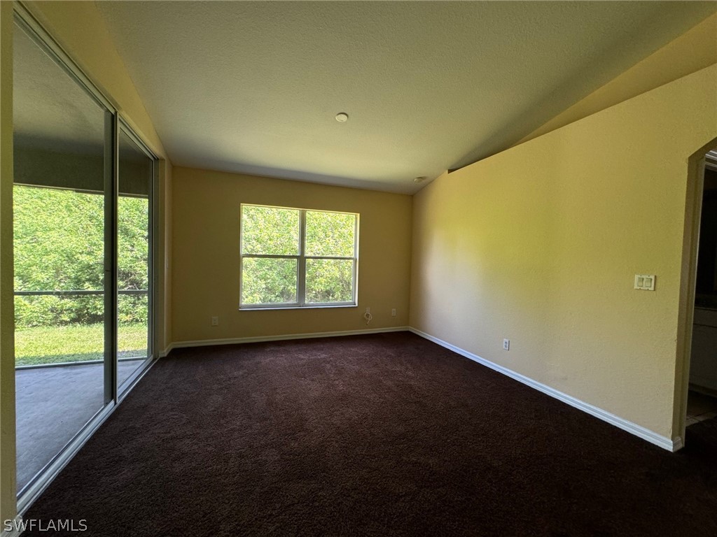 1841 Landale Loop Lehigh Acres, FL 33972 - Photo 6 of 21 a view of a big room with windows