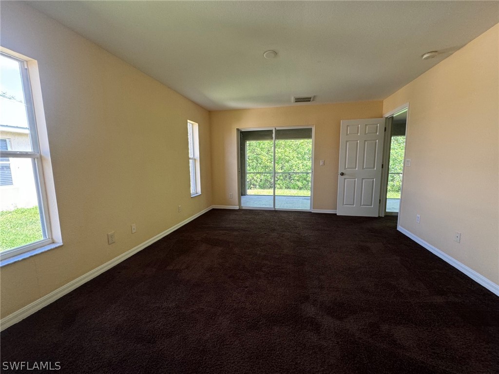 1841 Landale Loop Lehigh Acres, FL 33972 - Photo 8 of 21 a view of an empty room with a window