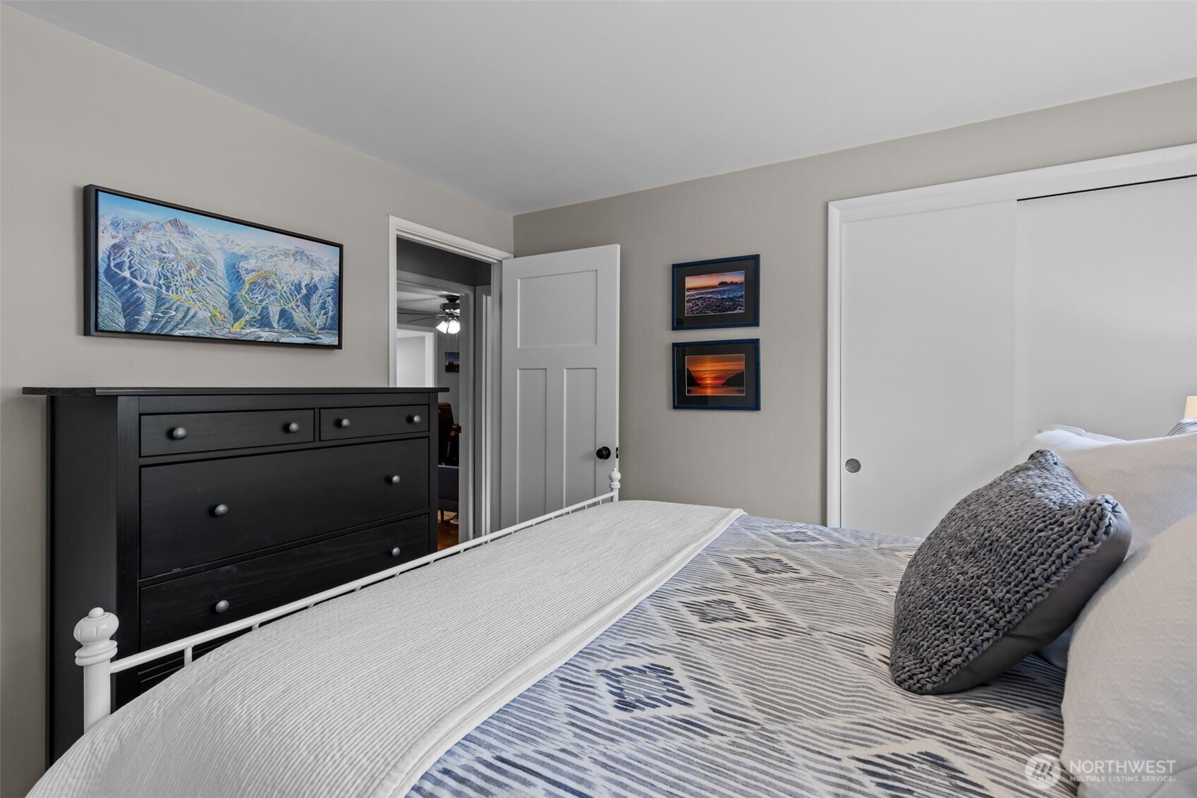 11462 35th Avenue Southwest Seattle, WA 98146 - Photo 13 of 26 a bedroom with a large bed and a dresser