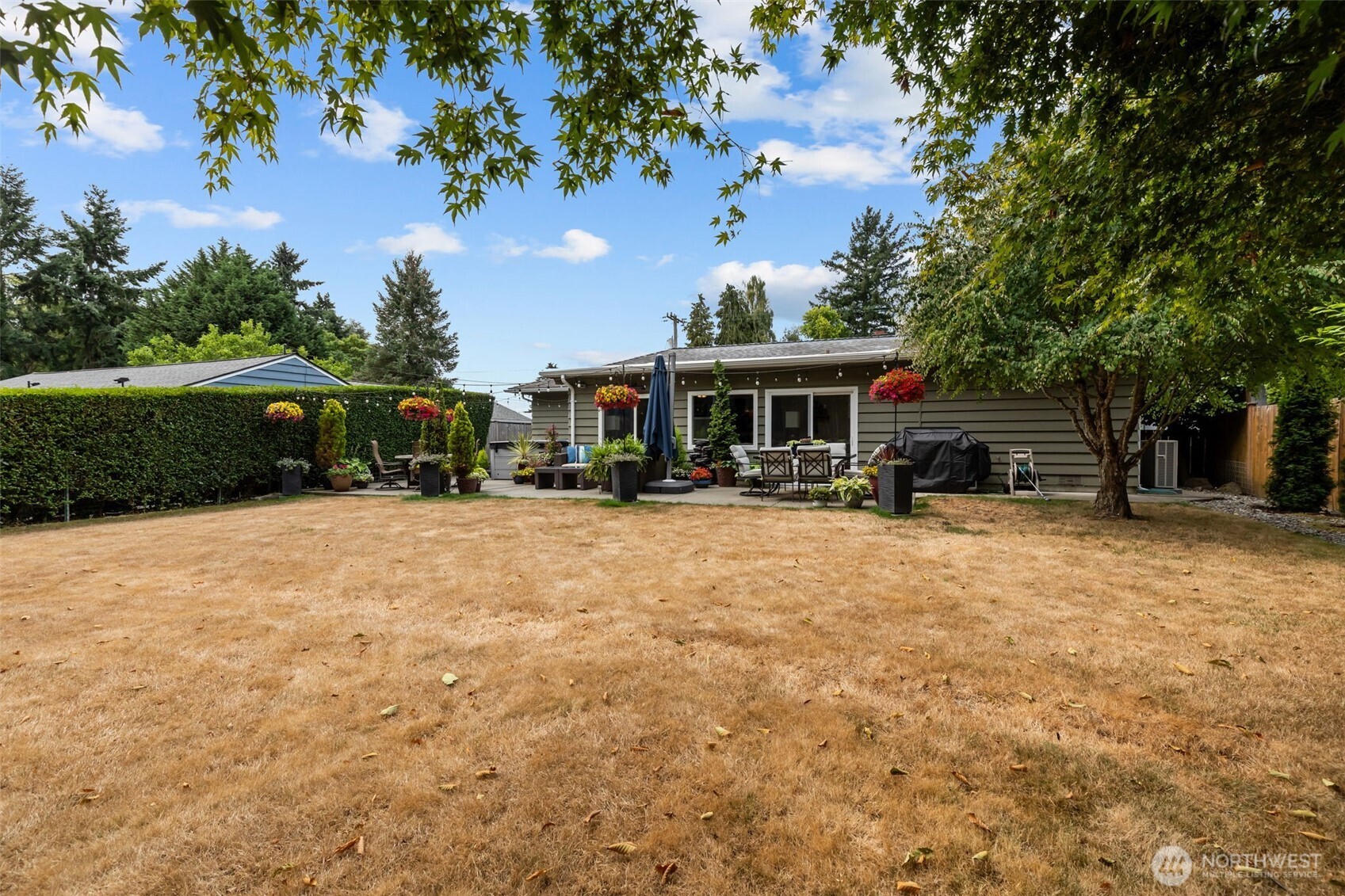 11462 35th Avenue Southwest Seattle, WA 98146 - Photo 19 of 26 a front view of a house with a yard