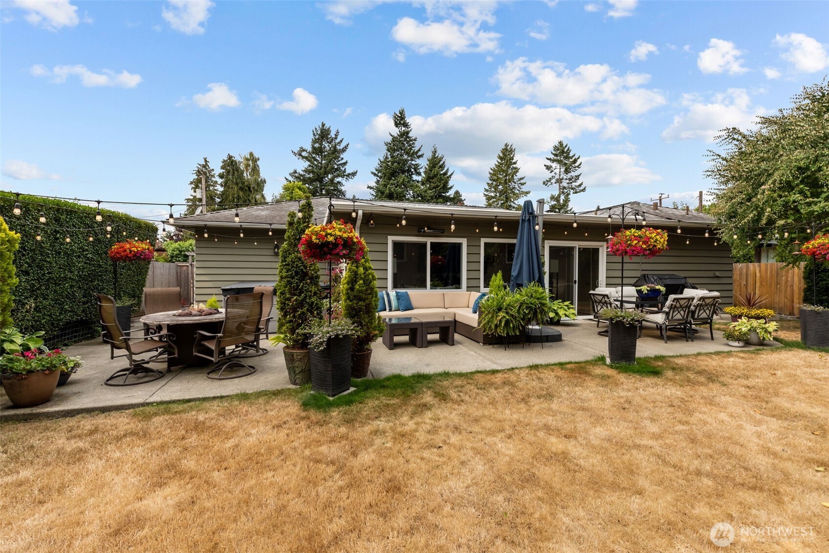 11462 35th Avenue Southwest Seattle, WA 98146 - Photo 20 of 26 a view of a house with patio and sitting area