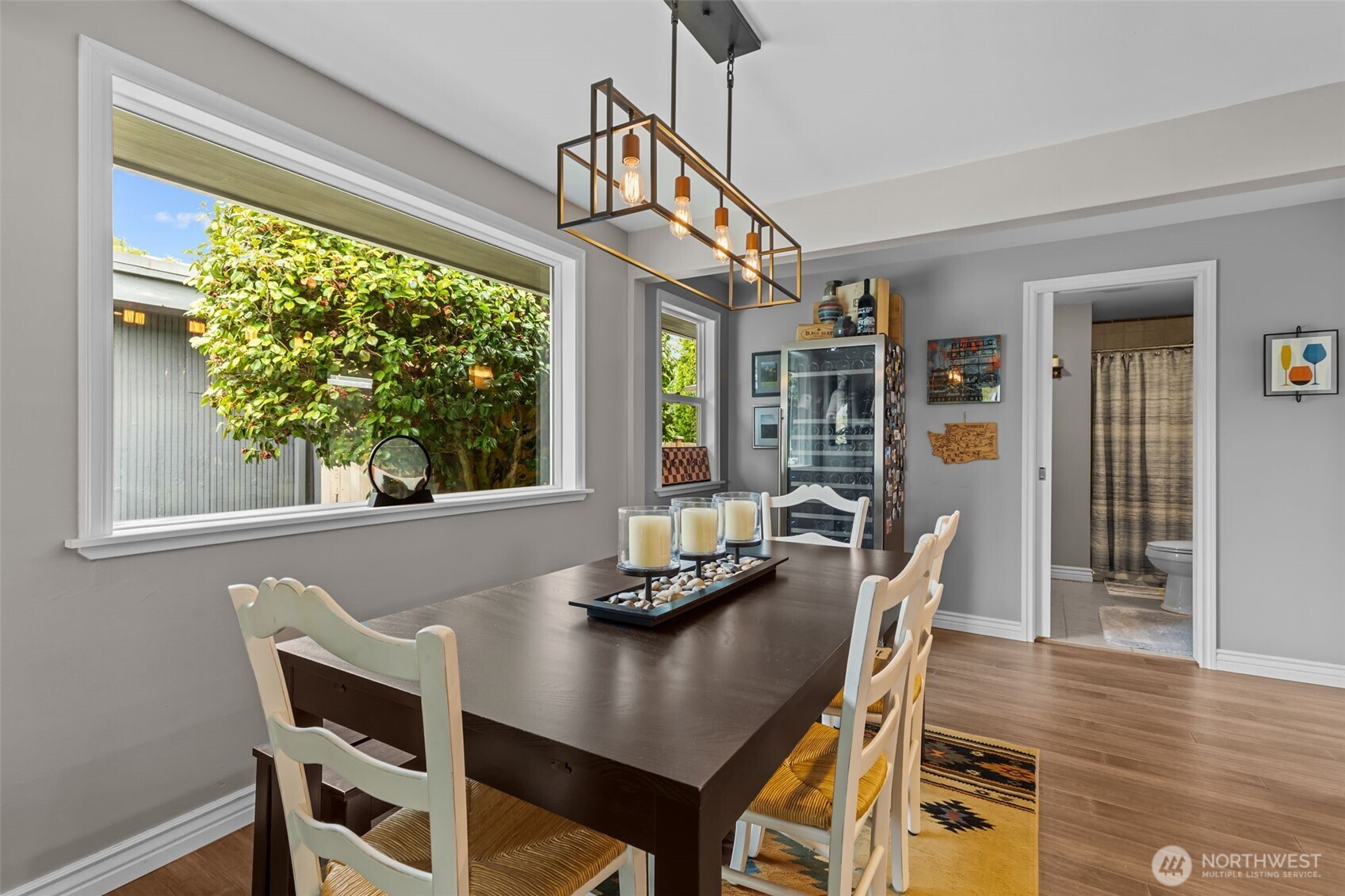 11462 35th Avenue Southwest Seattle, WA 98146 - Photo 4 of 26 a view of a dining room with furniture window and wooden floor
