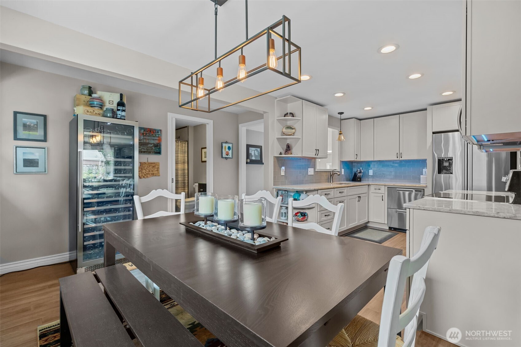 11462 35th Avenue Southwest Seattle, WA 98146 - Photo 5 of 26 a view of a dining room with furniture and wooden floor