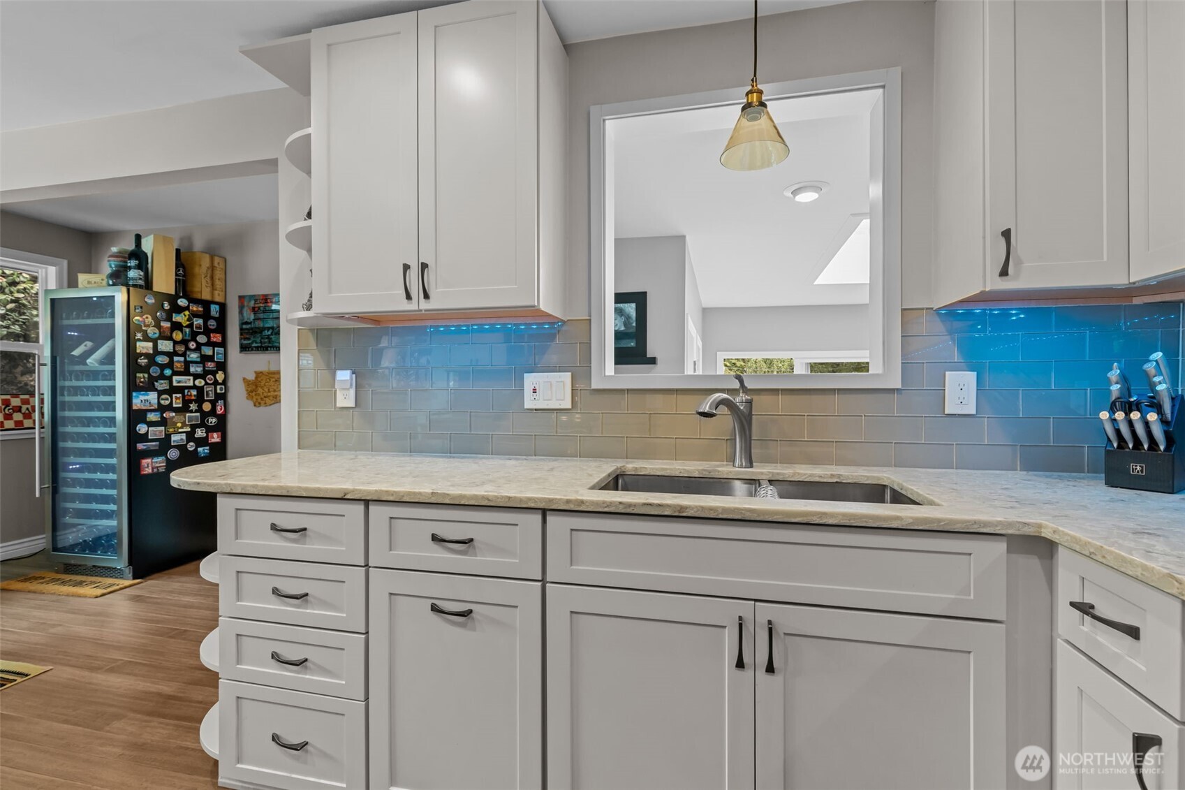 11462 35th Avenue Southwest Seattle, WA 98146 - Photo 6 of 26 a kitchen with cabinets appliances a sink and a counter top space