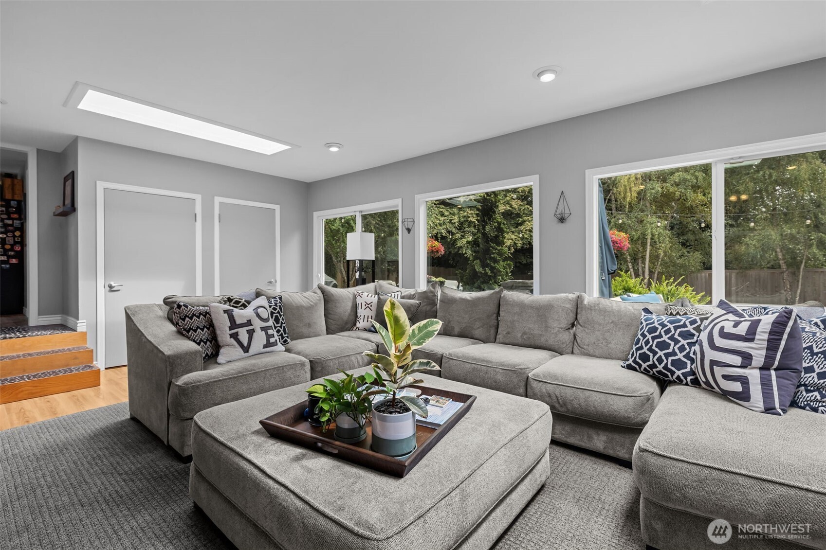 11462 35th Avenue Southwest Seattle, WA 98146 - Photo 9 of 26 a living room with furniture and a large window