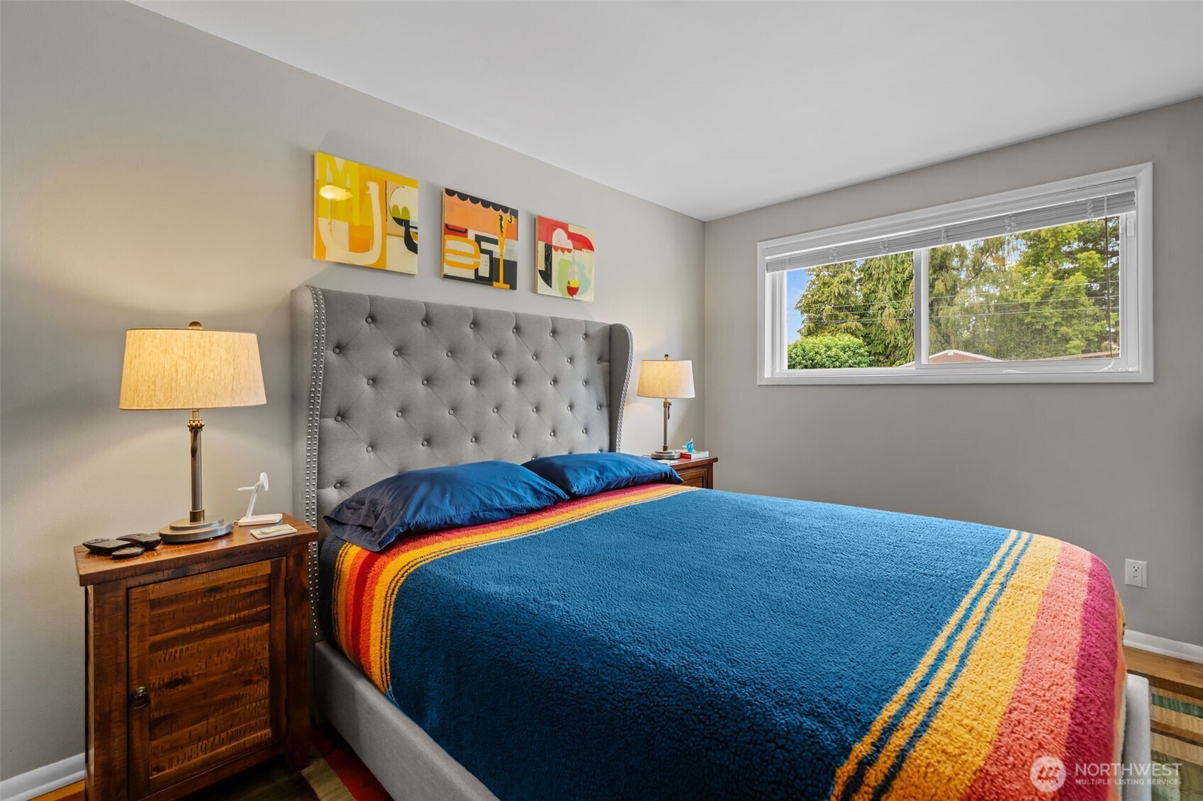 11462 35th Avenue Southwest Seattle, WA 98146 - Photo 10 of 26 a bedroom with a bed and a lamp on dresser
