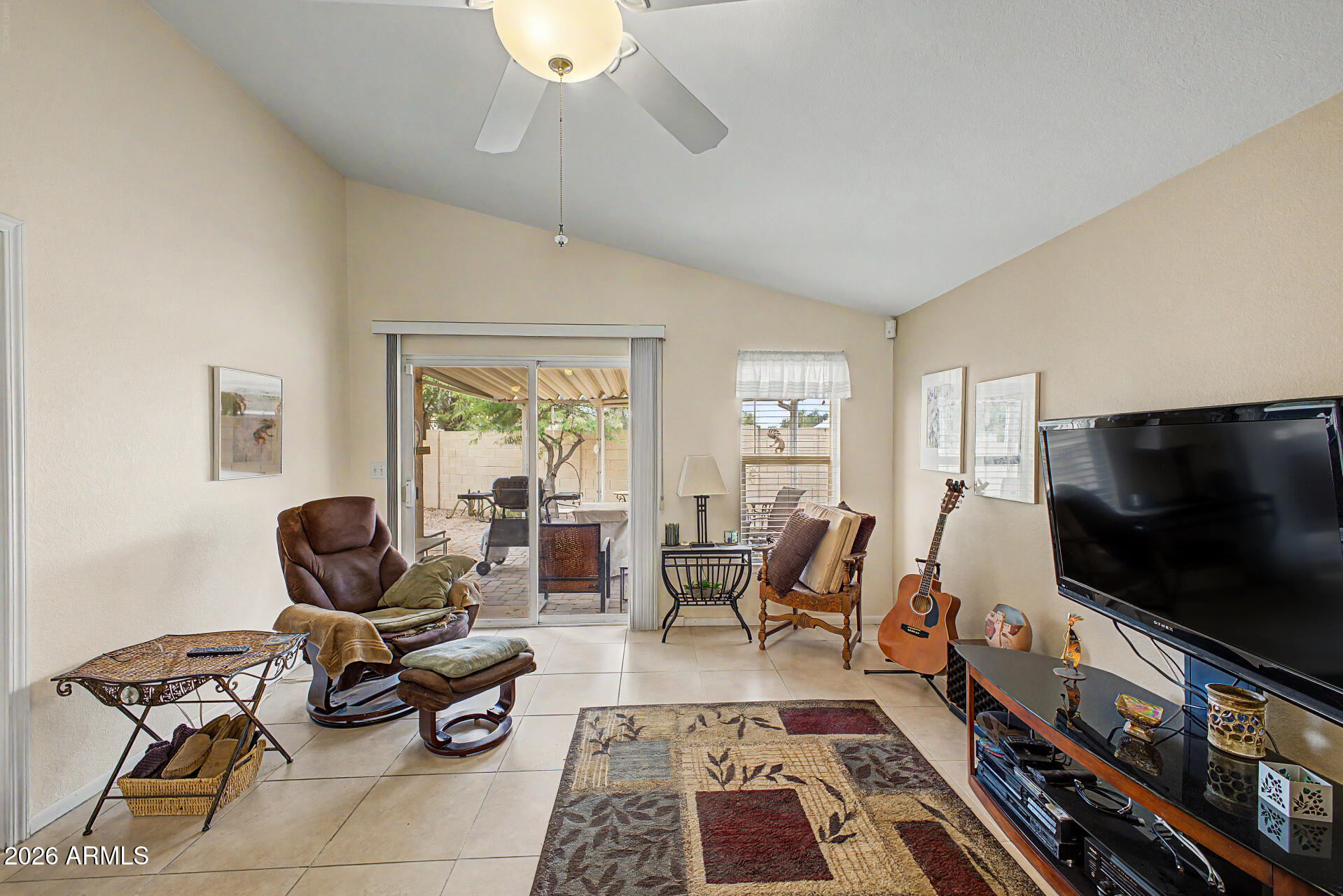 2101 South Meridian Road, Unit 45 Apache Junction, AZ 85120 - Photo 6 of 36 a living room with furniture and a flat screen tv