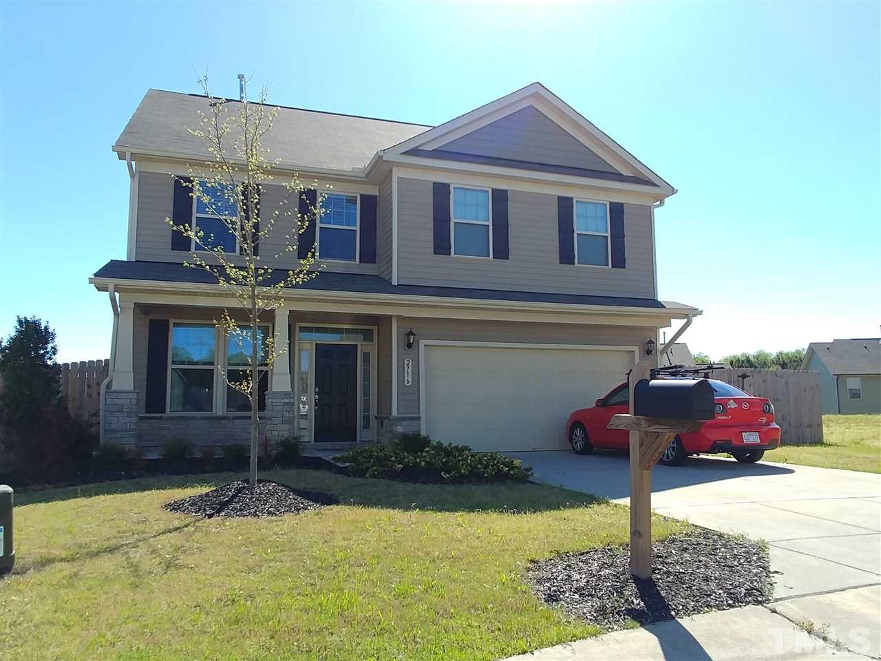 2716 Communion Court Raleigh, NC 27610 - Photo 1 of 17 a front view of a house with garden