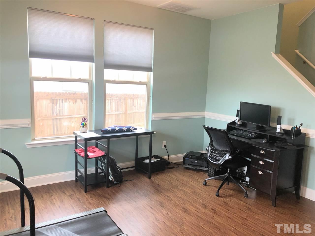 2716 Communion Court Raleigh, NC 27610 - Photo 5 of 17 a view of a workspace with furniture and a window