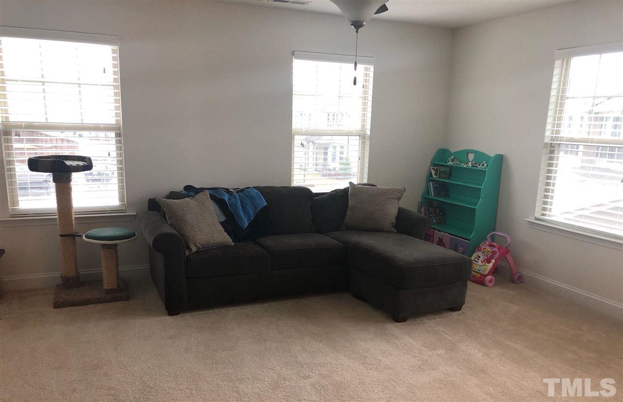 2716 Communion Court Raleigh, NC 27610 - Photo 6 of 17 a living room with furniture and a window