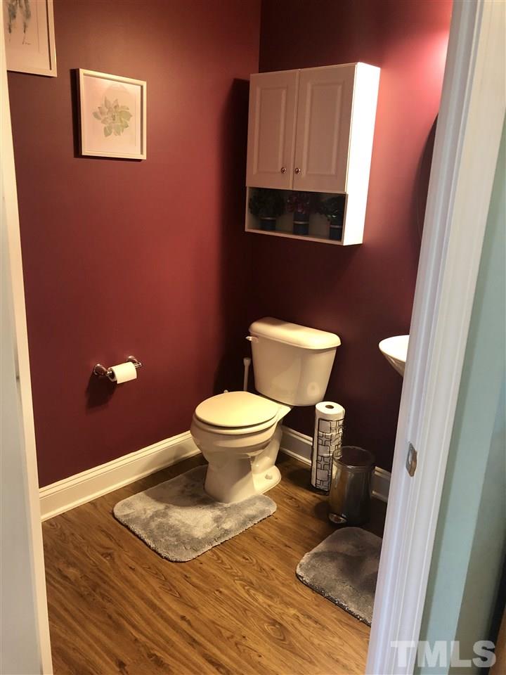 2716 Communion Court Raleigh, NC 27610 - Photo 7 of 17 a bathroom with a toilet and a mirror