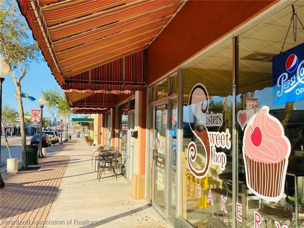 3312 Beartooth Pass Sebring, FL 33872 - Photo 38 of 39 a view of shops on a street