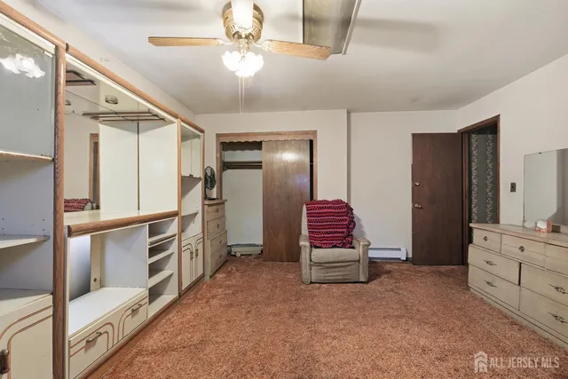 a view of kitchen with furniture and a ceiling fan