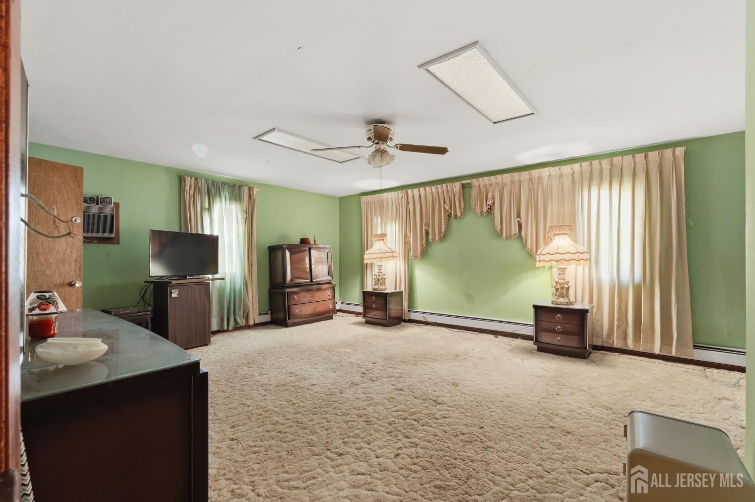 17 Birch Street Old Bridge, NJ 08857 - Photo 13 of 22 a living room with furniture and a flat screen tv