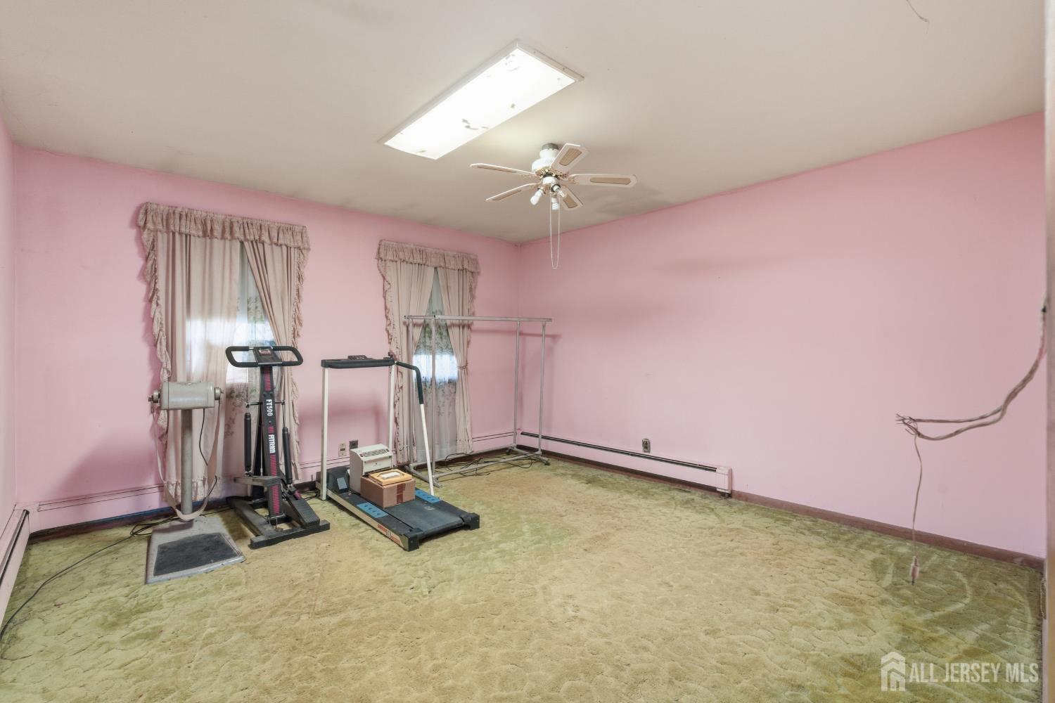 17 Birch Street Old Bridge, NJ 08857 - Photo 14 of 22 a room with gym equipment and windows