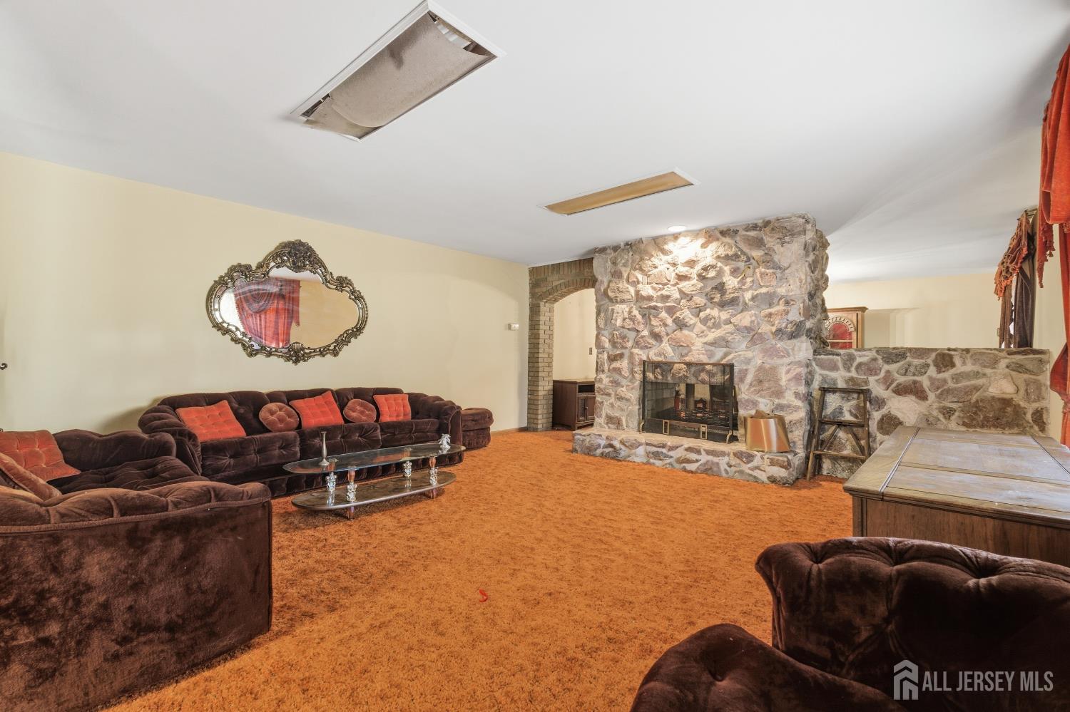 17 Birch Street Old Bridge, NJ 08857 - Photo 3 of 22 a living room with furniture a rug and a large window