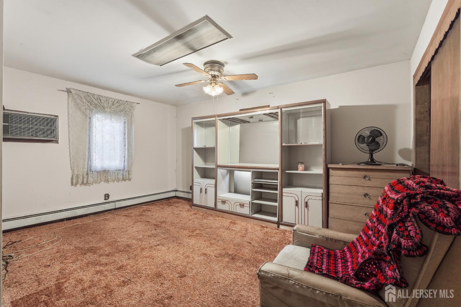 17 Birch Street Old Bridge, NJ 08857 - Photo 10 of 22 a living room with furniture cabinets and window