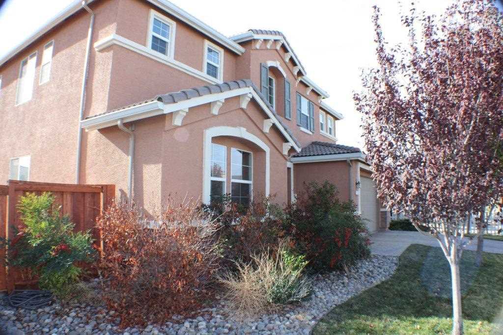 350 Sondrio Way Reno, NV 89521 - Photo 1 of 1 a front view of a house with garden