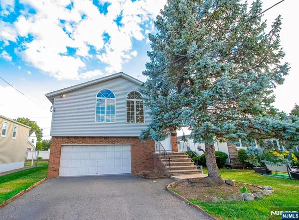a house view with a garden space