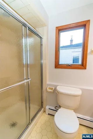 a white toilet sitting next to a bathroom sink