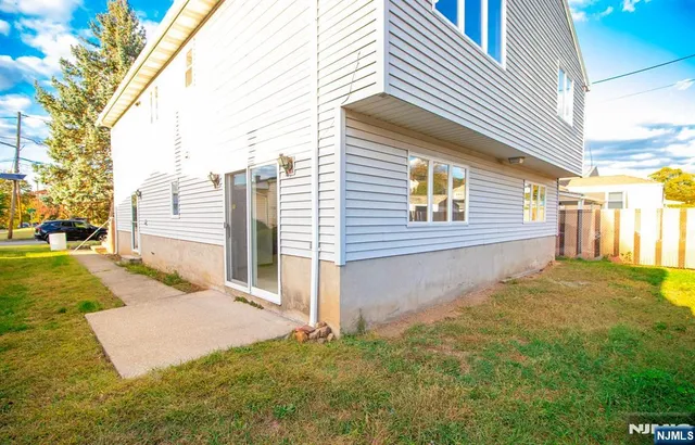 a view of a backyard of the house