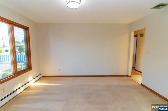 a view of an empty room and window