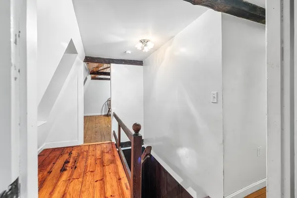 a view of staircase with wooden floor and stairs