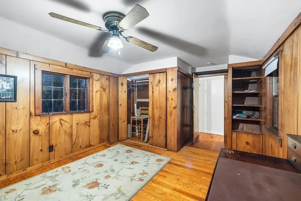 a bedroom with furniture a chandelier and a rug