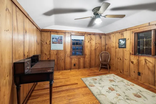 a view of entryway with wooden floor and stairs