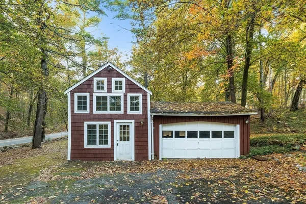 a house with trees in front of it