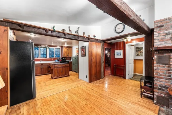 a kitchen with a refrigerator and a sink