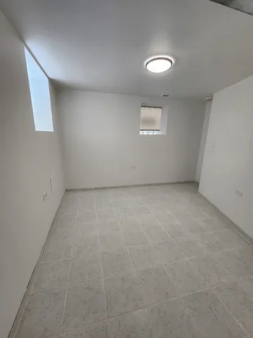 an empty room with a empty space and window