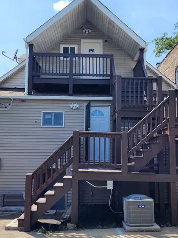 a view of balcony with wooden deck