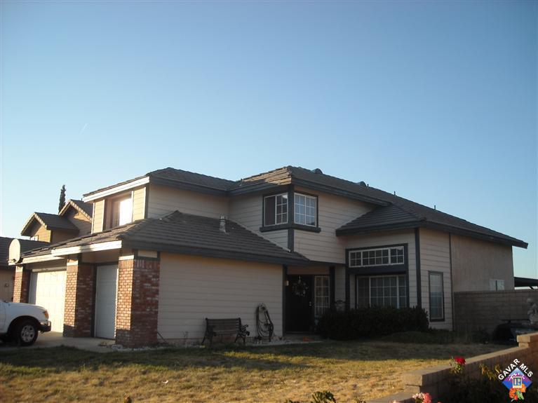 3125 Shale Road Palmdale, CA 93550 - Photo 1 of 8 a front view of a house with garage