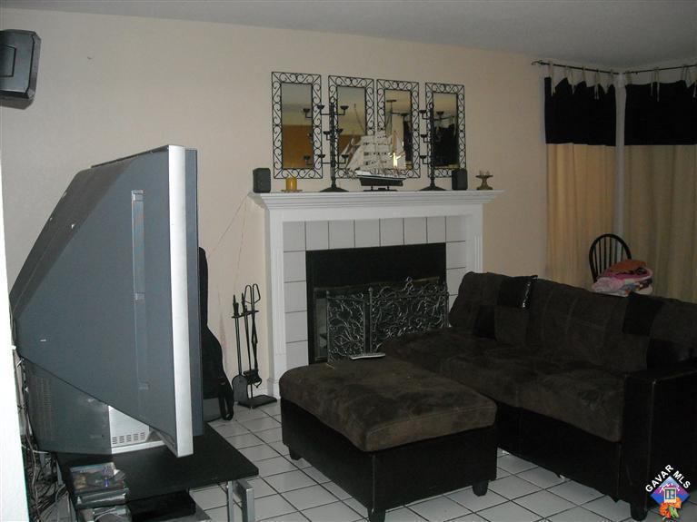 3125 Shale Road Palmdale, CA 93550 - Photo 4 of 8 a living room with furniture and a fireplace