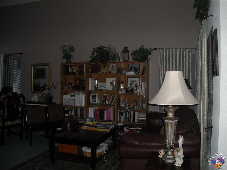 3125 Shale Road Palmdale, CA 93550 - Photo 6 of 8 a living room filled with furniture and a lamp