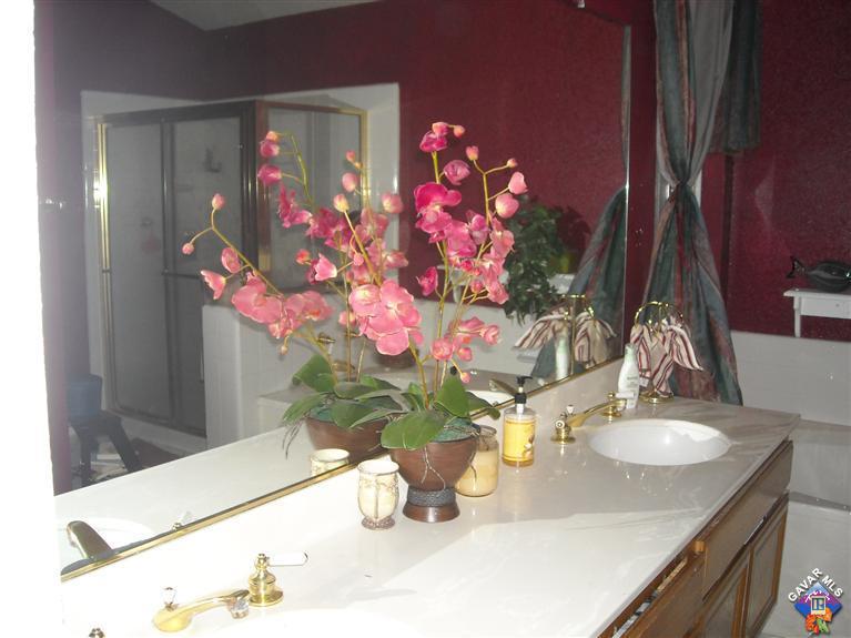 3125 Shale Road Palmdale, CA 93550 - Photo 7 of 8 a vase of flowers sitting on a dining table