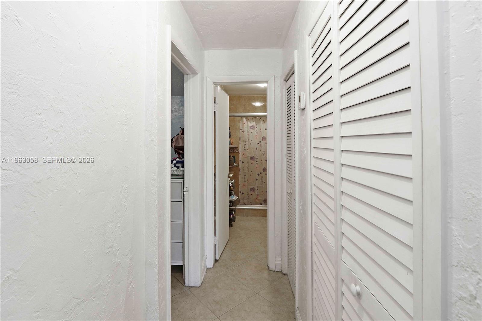 1275 West 35th Street, Unit 45B Hialeah, FL 33012 - Photo 13 of 32 Hallway to the rooms