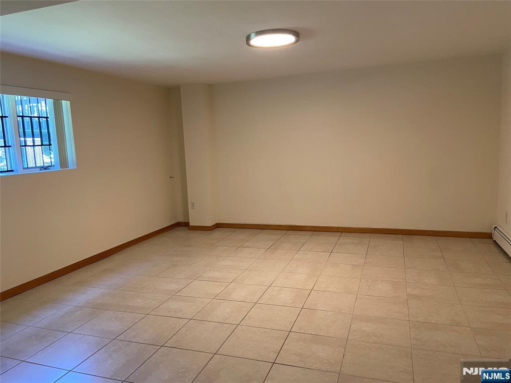 2416 Hammett Avenue, Unit A Fort Lee, NJ 07024 - Photo 8 of 8 a view of an empty room and window