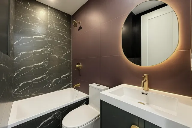 a bathroom with a sink and mirror