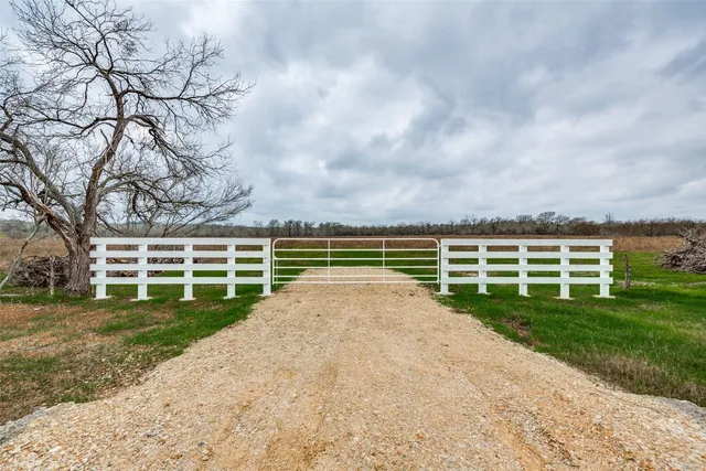 a view of a road with a yard