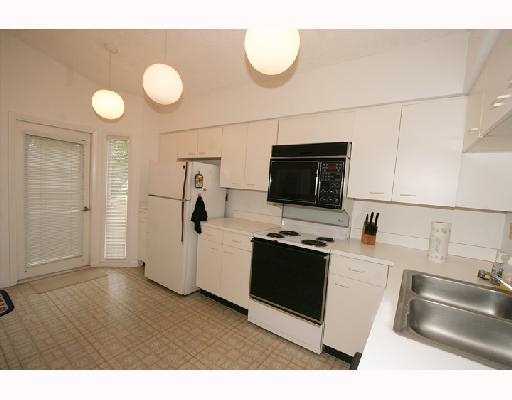 5359 Buckhead Circle Boca Raton, FL 33431 - Photo 3 of 8 a kitchen with stainless steel appliances granite countertop a sink and a stove