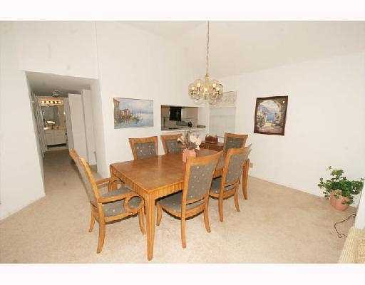 5359 Buckhead Circle Boca Raton, FL 33431 - Photo 4 of 8 a dining room with furniture and chandelier