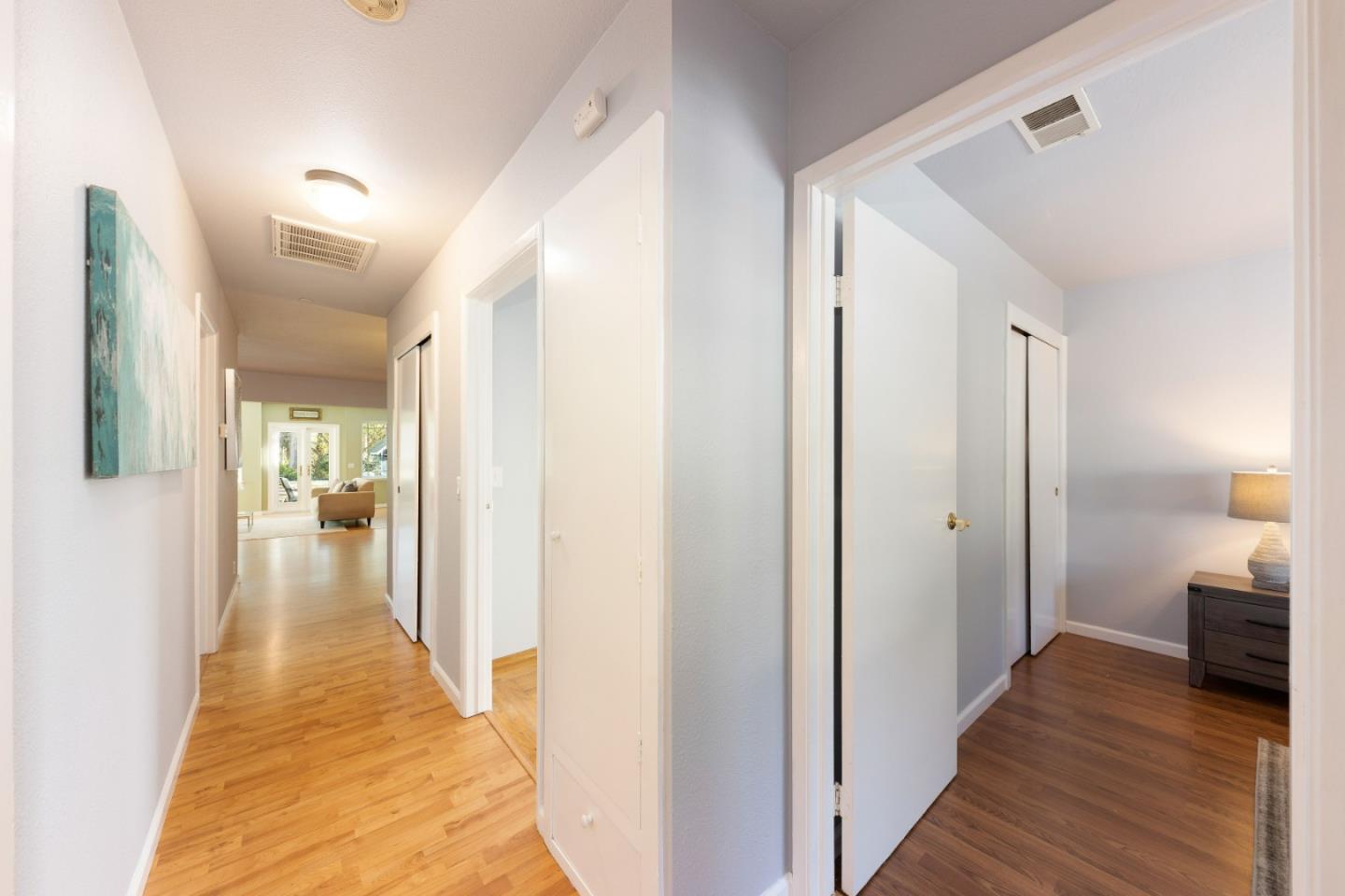 1168 Crespi Drive Pacifica, CA 94044 - Photo 17 of 42 a view of a hallway with wooden floor and staircase