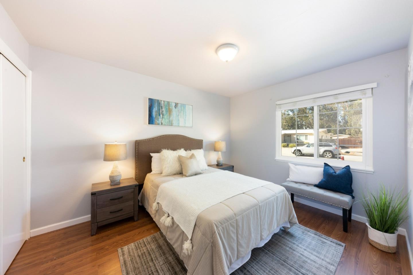 1168 Crespi Drive Pacifica, CA 94044 - Photo 20 of 42 a bedroom with bed and wooden floor